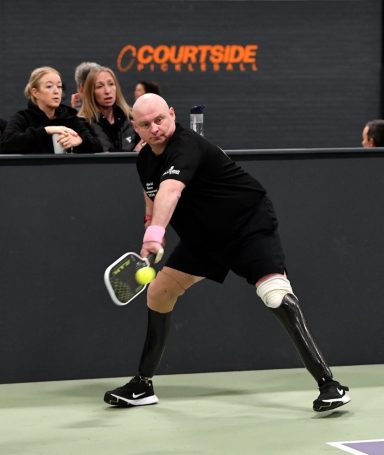 Mark Fosbrook hitting a backhand