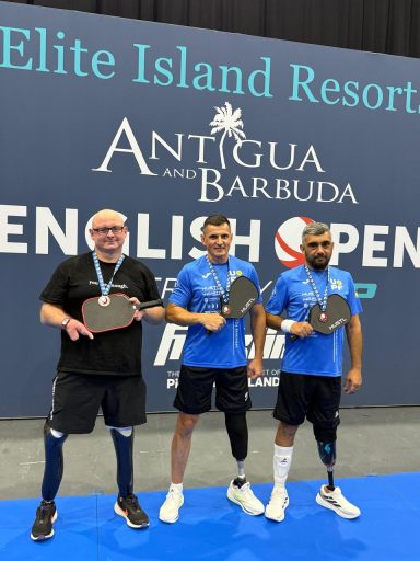 The Para Standing Medalists from the English Open Pickleball Championships with their medals.