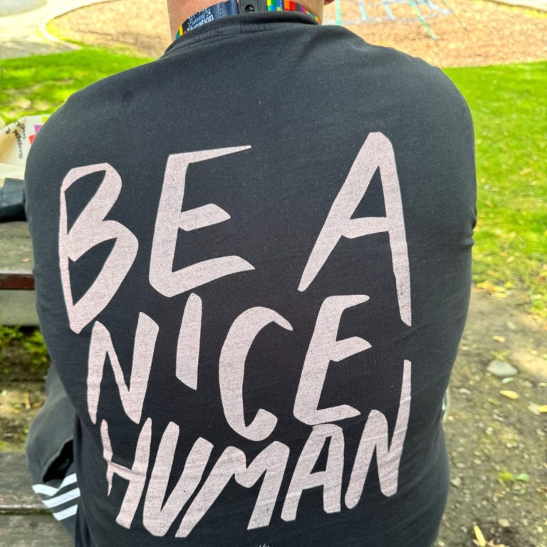 T-shirt with Be a Nice Human printed on back